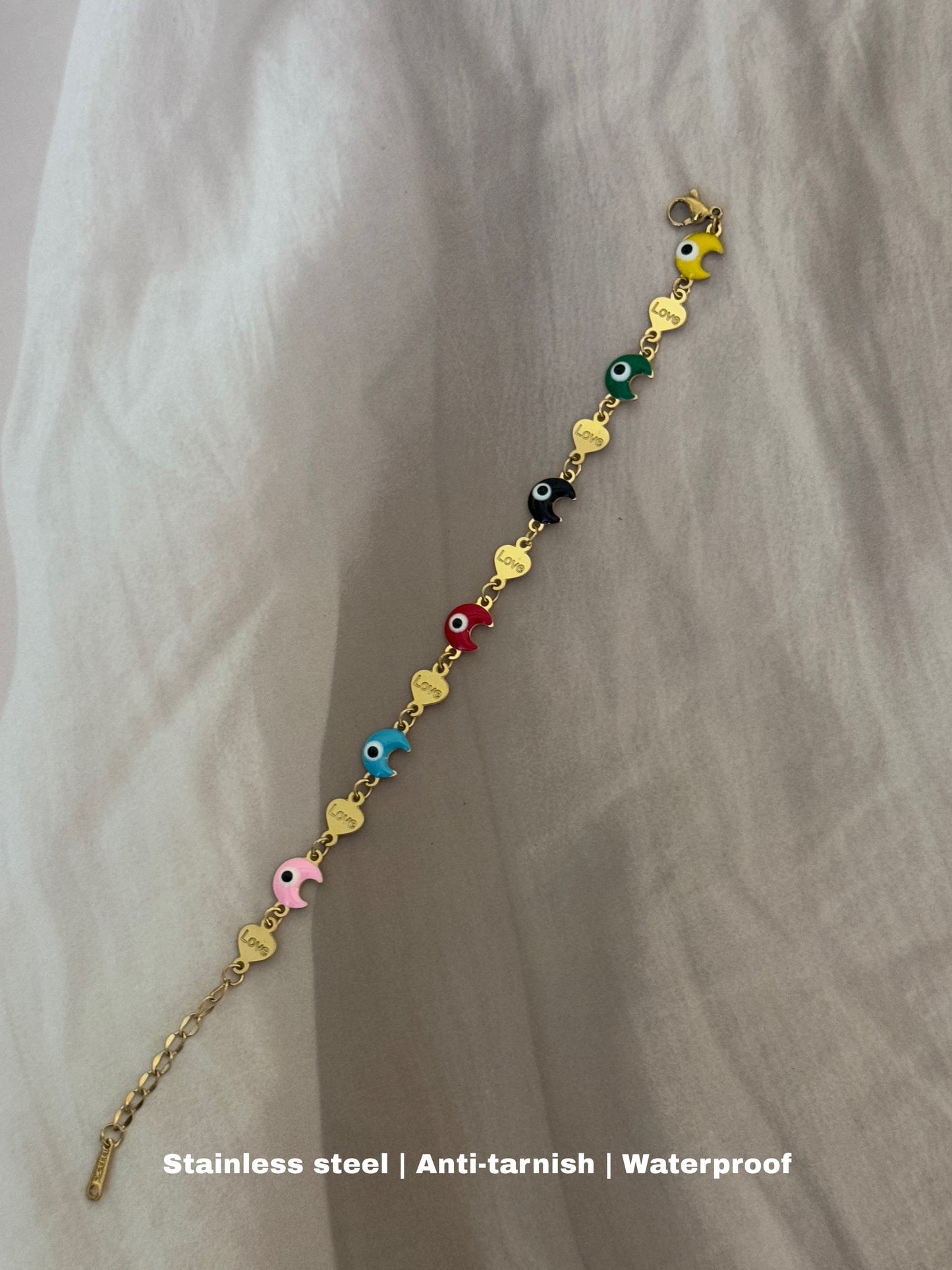 stunning stainless steel bracelet with colorful evil eye charms is