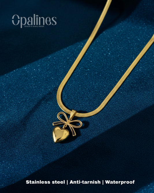 gorgeous gold necklace features a heart-shaped pendant