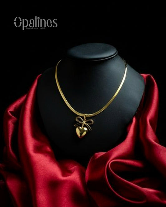 gorgeous gold necklace features a heart-shaped pendant